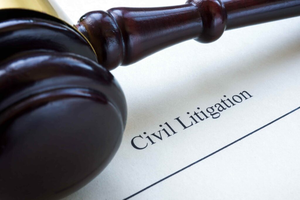 Judge’s gavel resting on a document labeled “Civil Litigation,” symbolizing lawsuit proceedings, legal disputes, and courtroom representation.