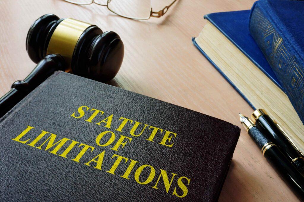 Statute of limitations law book with judge’s gavel and legal documents on desk, representing time limits for filing lawsuits and legal claims. Statute of limitations law book with judge’s gavel and legal documents on desk, representing time limits for filing lawsuits and legal claims.