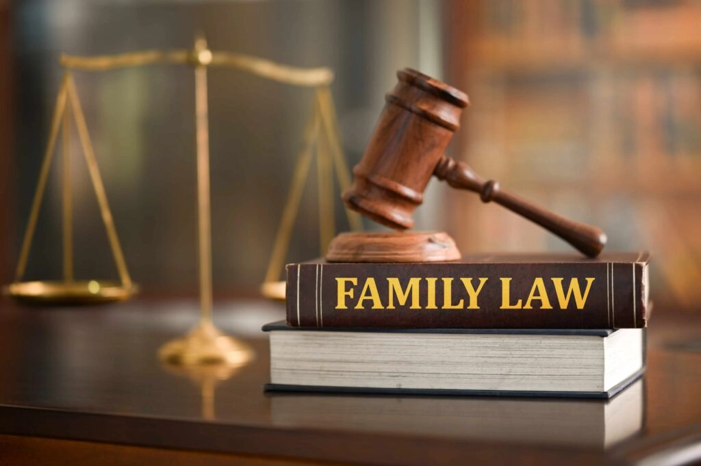 Judge’s gavel resting on a “Family Law” book with scales of justice in the background, representing divorce, child custody, and family court legal services.