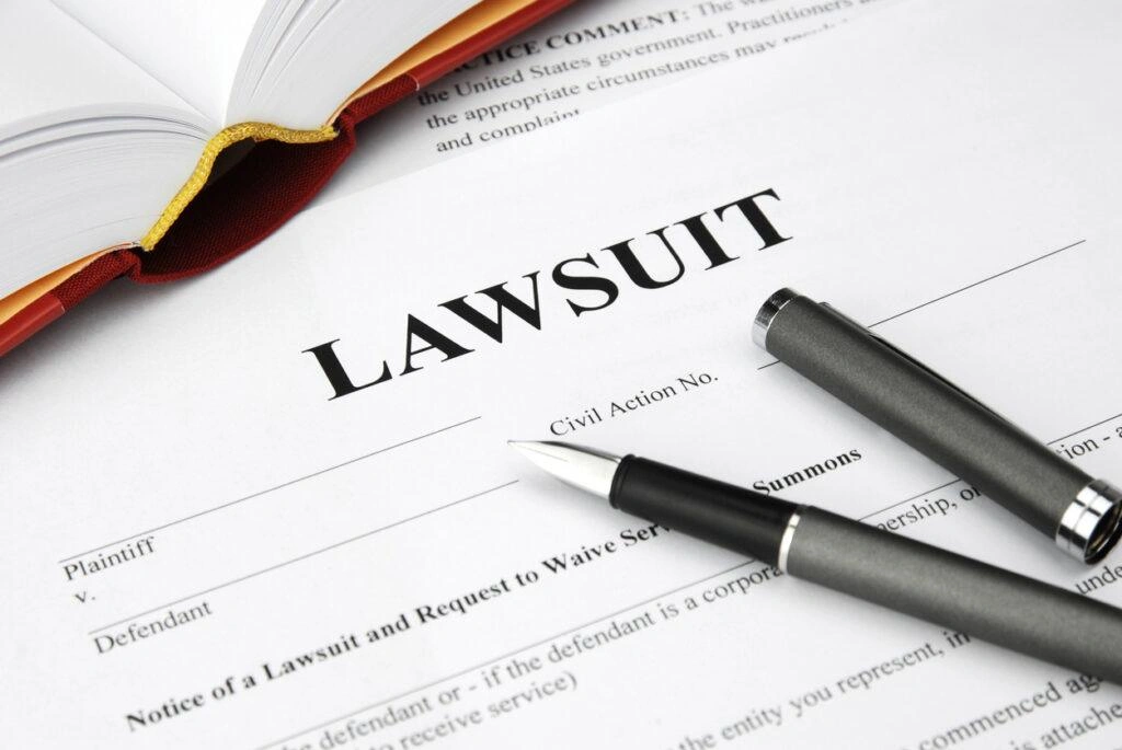 lawsuit form with filler and book